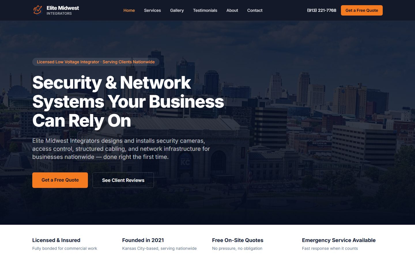 Elite Midwest Integrators homepage: a dark navy hero over a Kansas City skyline photo with the headline 'Security & Network Systems Your Business Can Rely On,' a top nav bar, and orange 'Get a Free Quote' buttons